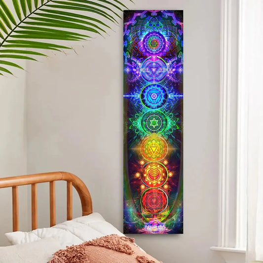 Colorful chakra design tapestry on a wall above a bed